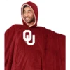 NCAA Oklahoma Sooners Team Color Bloncho With Logo Patch And Faux Shearling Inside Throw Blanket 2 NCAA Oklahoma Sooners Team Color Bloncho With Logo Patch And Faux Shearling Inside Throw Blanket -Nacc GUEST dc4ca27f 0511 47ef 9fff 296f555b3668